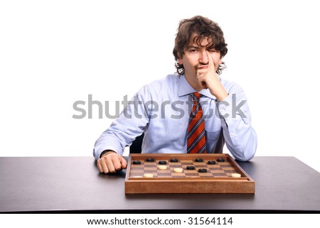businessman playing checkers, studio photo