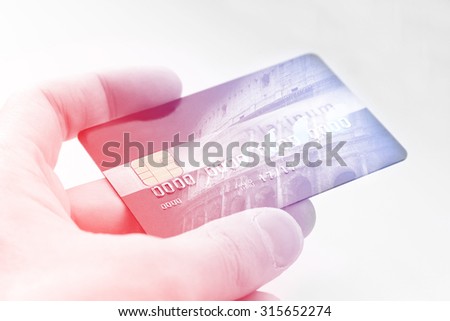 Double exposure of hand with credit card. Business and travel concept. Vintage style  filtered picture