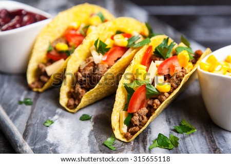 Mexican food - delicious tacos with ground beef Royalty-Free Stock Photo #315655118