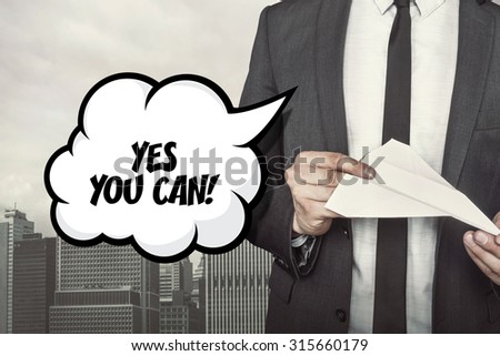 Yes you can text on speech bubble with businessman holding paper plane in hand on city background