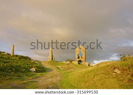 Cornwall's industrial heritage, the unique ruins of Holman's Engine house at South Caradon Mine on the edge of Bodmin Moor at sunset, Cornwall, England, United Kingdom
