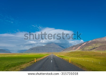 Isolated road and mountain landscape at Iceland, summer, 2015