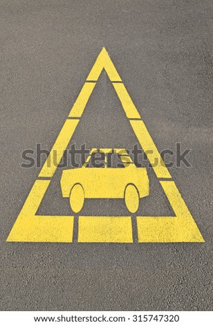 Car sign at the road crossing, danger
