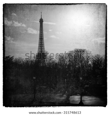 Romantic eiffel tower.  Cross processed  to look like and aged and instant picture with texture
