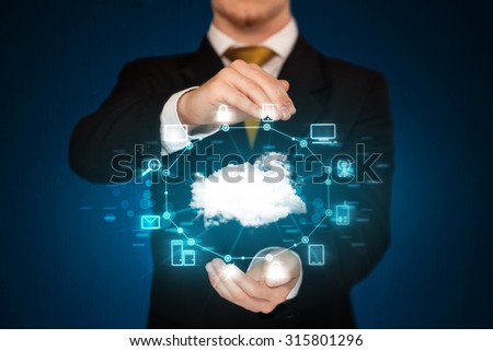 Businessman holding digital icons, Cloud computing concept