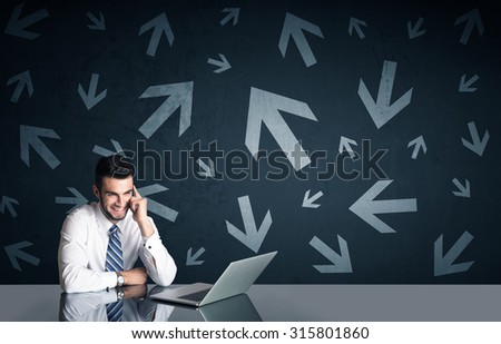 Successful businessman with arrows in background
