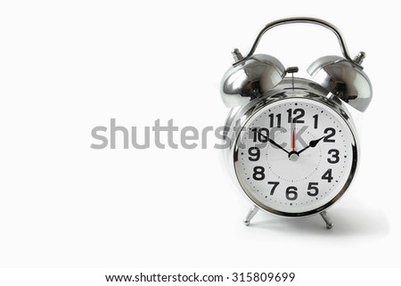 Silver alarm clock on white background