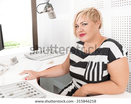 Radio host in her music studio.