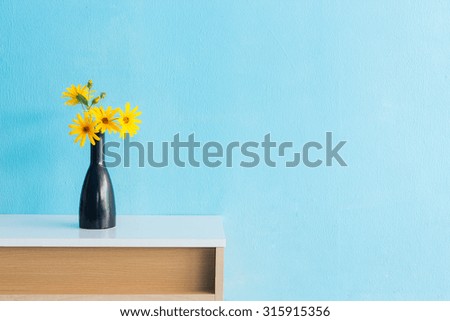 Jerusalem artichoke flower in vase on table interior design