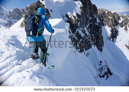 Skier in deep powder, extreme winter freeride Royalty-Free Stock Photo #315925073