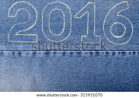 Numbers 2016 of chalk contour on the background of the jeans. Christmas theme.