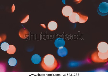 Defocused abstract red and blue christmas background. Toned.