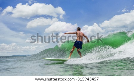 Picture of Man Surfing a Wave 