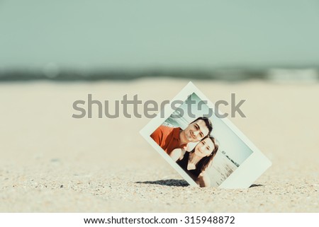 Retro Instant Photo Of Young Happy Couple On The Beach