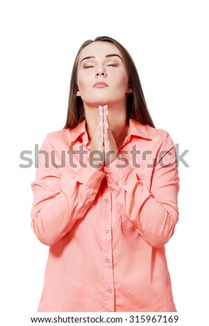 Praying girl isolated on white background