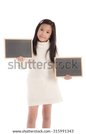 Cute asian girl in white turtleneck dress holding blackboard on white background isolated