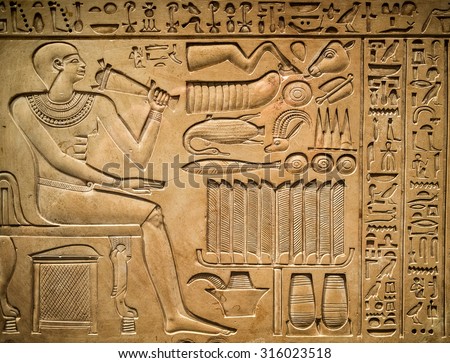 Ancient egyptian hieroglyph depicting a pharaoh, animals and signs Royalty-Free Stock Photo #316023518