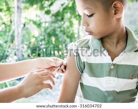 Shot of human hands making an injection with a syringe
 Royalty-Free Stock Photo #316034702