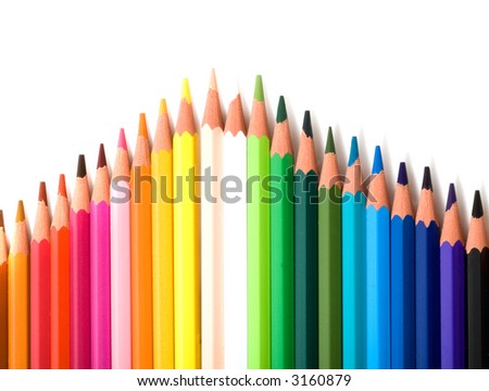 coloured pencils with shadow on white background