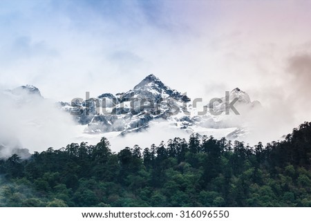 Cloudy Sky Snow mountain with fog , Lachen North Sikkim India Royalty-Free Stock Photo #316096550