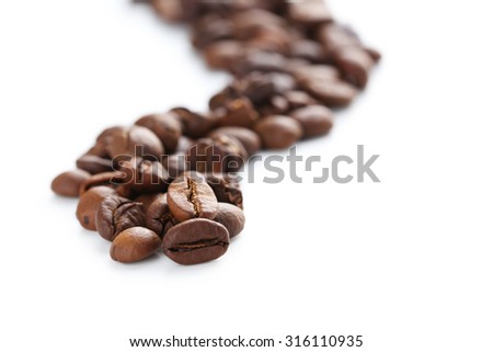 Roasted coffee beans on a white background