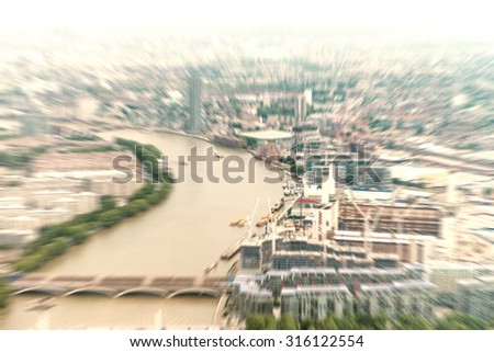 Blurred aerial view of London buildings.