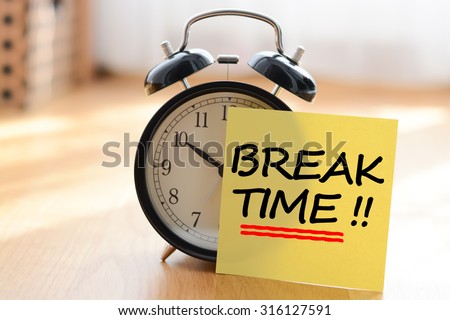 Break time concept with classic alarm clock Royalty-Free Stock Photo #316127591