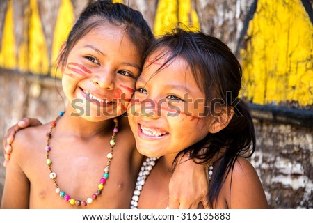 Cute Brazilian indians paying in Amazon, Brazil Royalty-Free Stock Photo #316135883