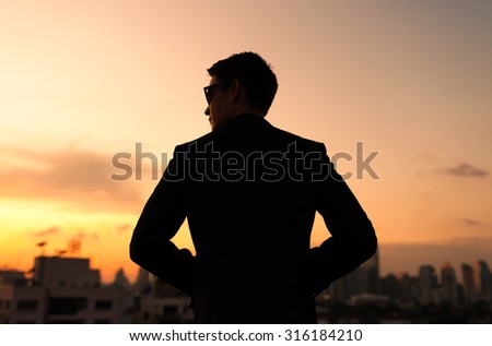 Silhouette of male in the city. 