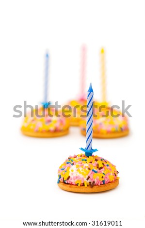 Cup cakes and candle isolated on the white background