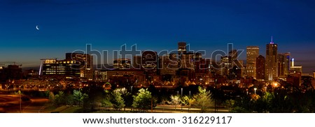Denver skyline night with crescent moon