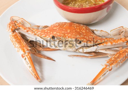 Hot Steamed red Crabs on dish and sauce
