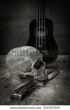 Still life with human skull and knife,Love style