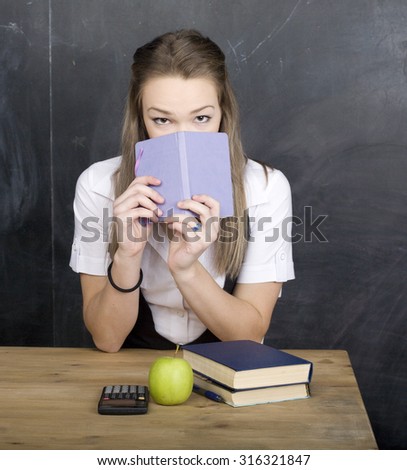 young cool teenager girl in classroom at blackboard learning