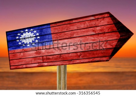 Burma Flag wooden sign on beach background
