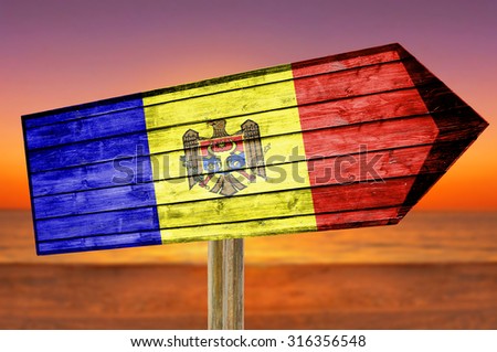Moldova Flag wooden sign on beach background