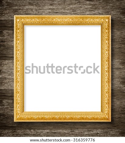 Antique gold frame on wooden wall background