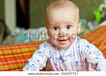 Portrait of adorable smiling baby boy