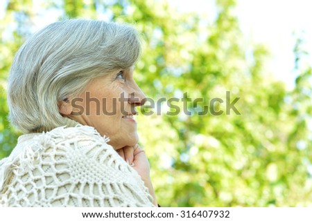 Portrait of a senior woman in autumn park
