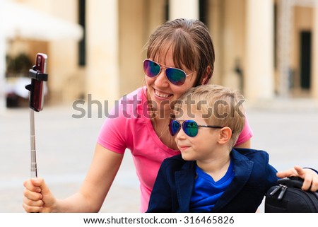 mother and son taking selfie stick picture while travel in Europe, Malta