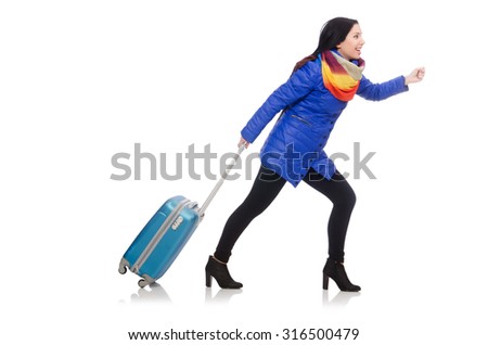 Pretty girl in blue winter jacket with suitcase isolated on white