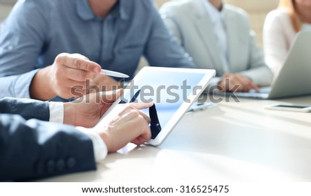Business adviser analyzing financial figures denoting the progress in the work of the company Royalty-Free Stock Photo #316525475