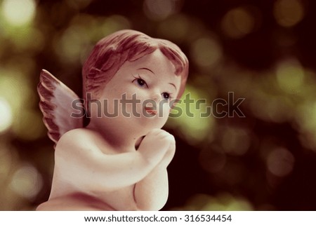 Angelic cupid statue - vintage retro effect style picture