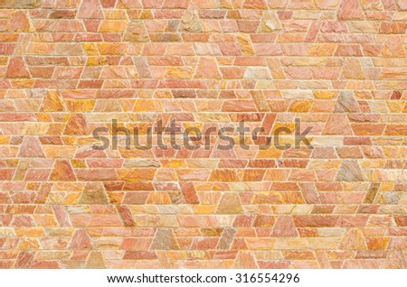 pattern color of modern style  design decorative  red slate stone wall surface with cement in trapezoid shape