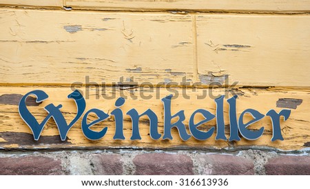 Sign winecellar on old wooden wall in Germany