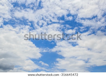 White clouds in the blue sky for any design