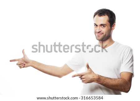 life style  and people concept: Young smiling happy man shows something on white background.