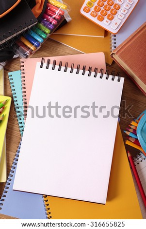 College student desk background with notepad, copy space, vertical