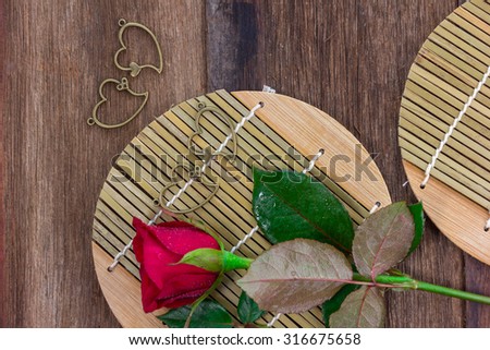 red roses on wooden background (concept valentine day)