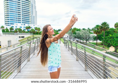 beautiful girl taking selfie